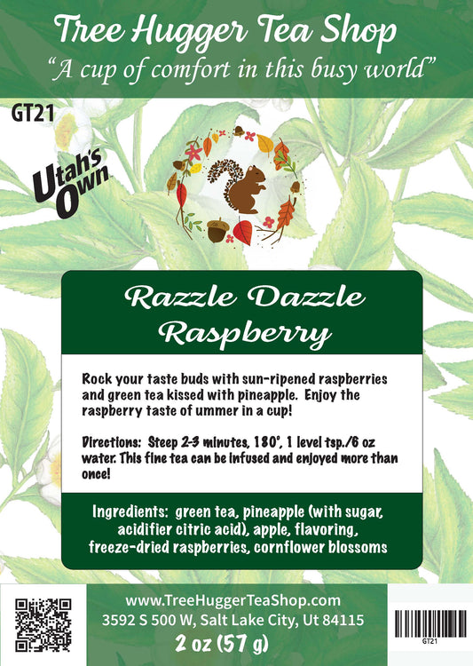Tea package label for 'Razzle Dazzle Raspberry' from Tree Hugger Tea Shop with green tea leaves in the background.